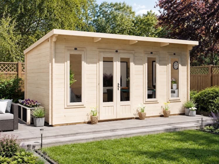 The Lynx Lair 5 x 3 metre pent log cabin with glazed double doors, installed in a garden